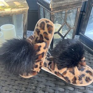 Cheetah print cross over slippers with pom Poms